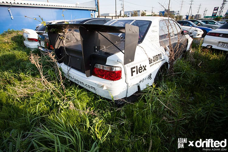 How Long Can a Car Sit Without Being Driven? - Image overgrown car storage