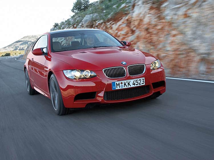 335i Vs M3 - Which Is Best? - Image red bmw m3 rolling tracking shot