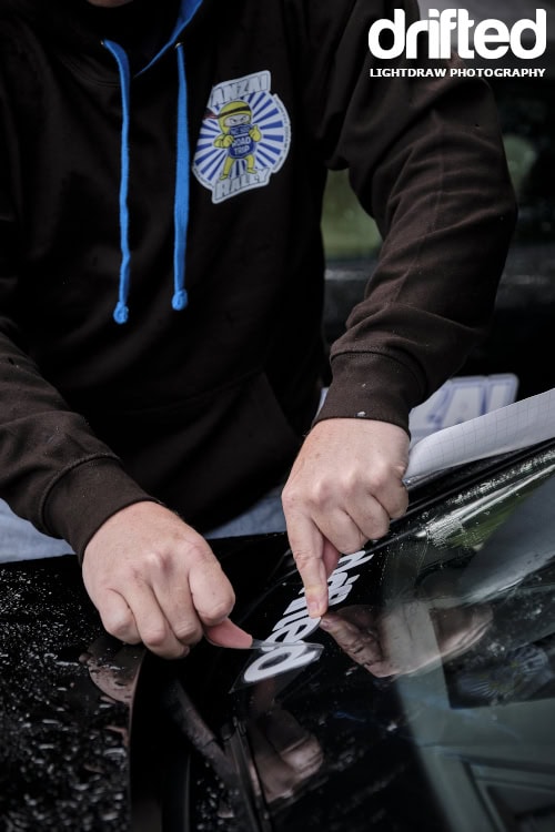 Banzai Rally: North Coast 500 - Image applying sticker to windshield
