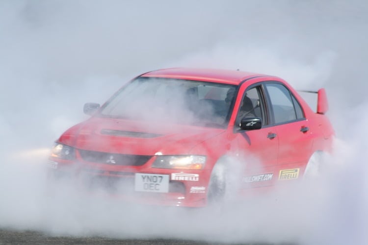 Mitsubishi Evo 8 (VIII) - The JDM Supercar Killer? - Image red evolution 8-in smoke evo 8
